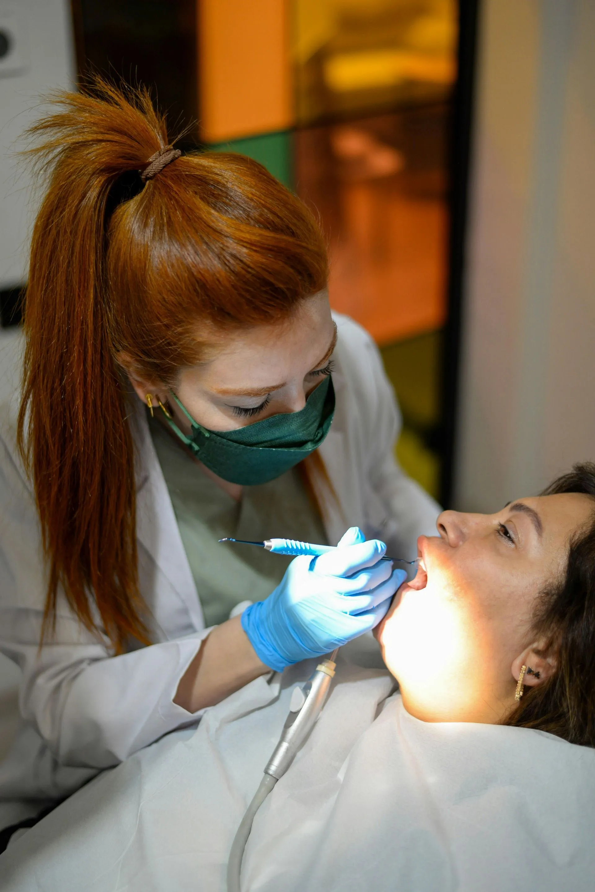 Dentist examining a patient in a clinic