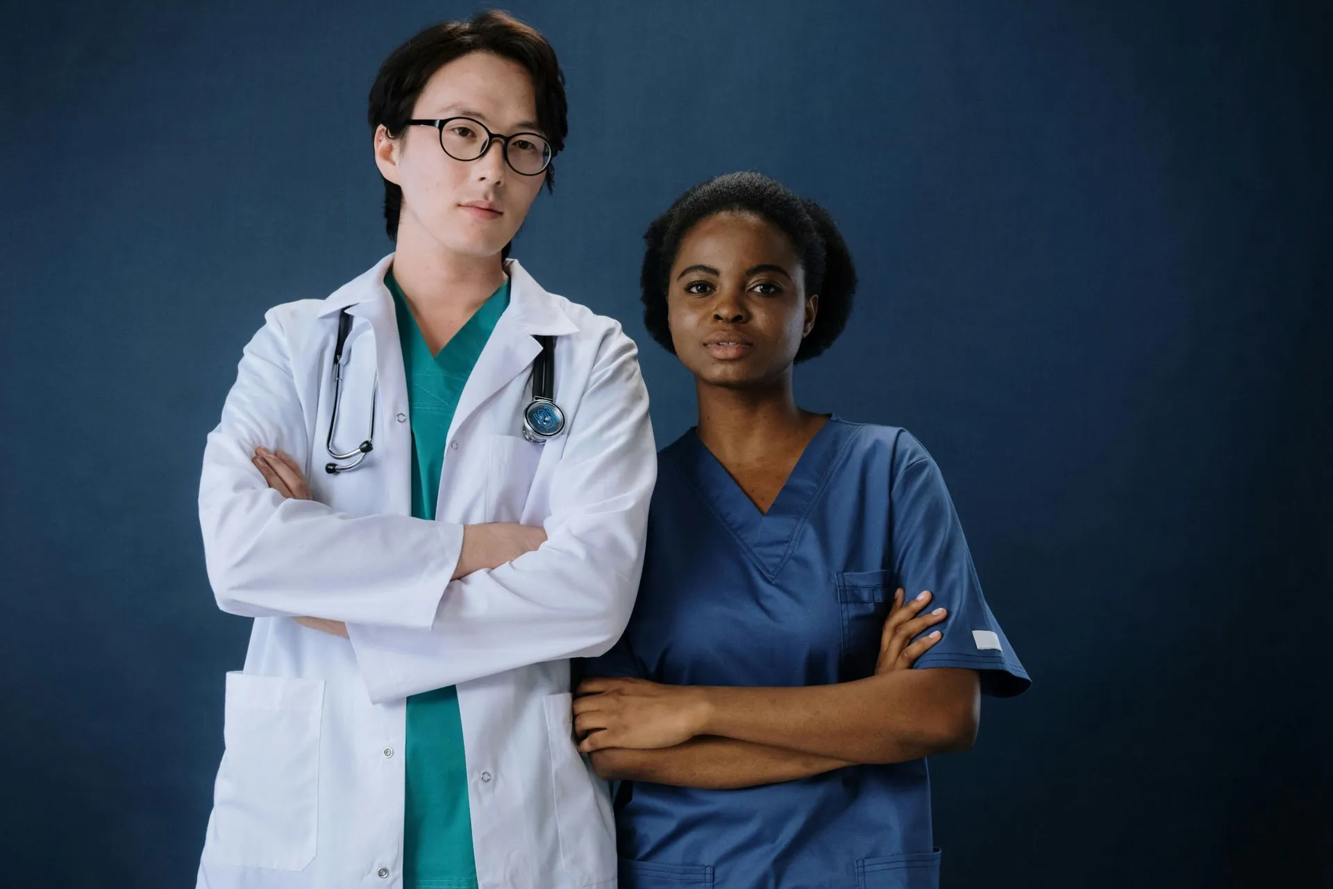 Two healthcare providers in a clinical setting