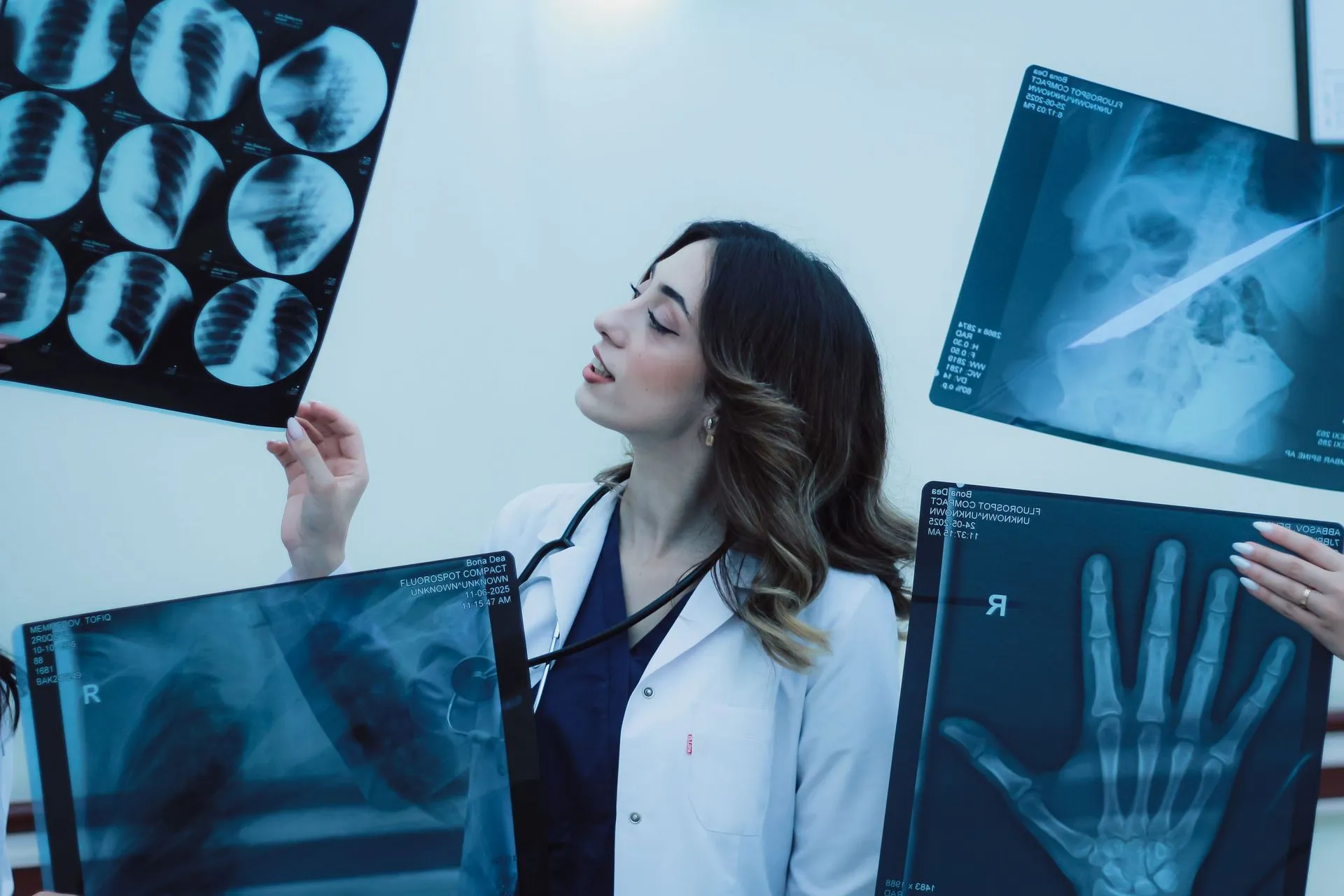 Doctor examining X-ray films