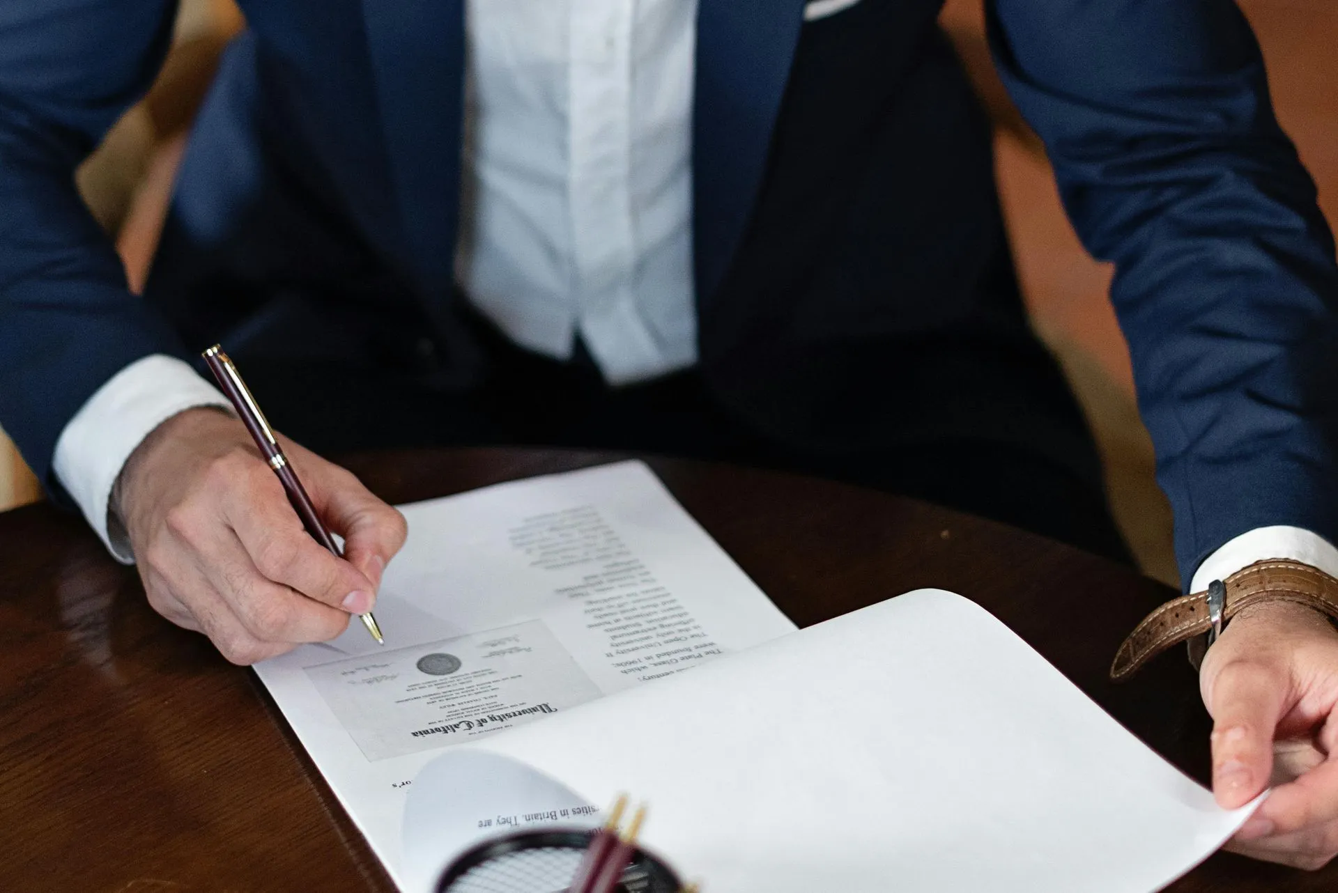 Professional submitting an insurance claim with paperwork