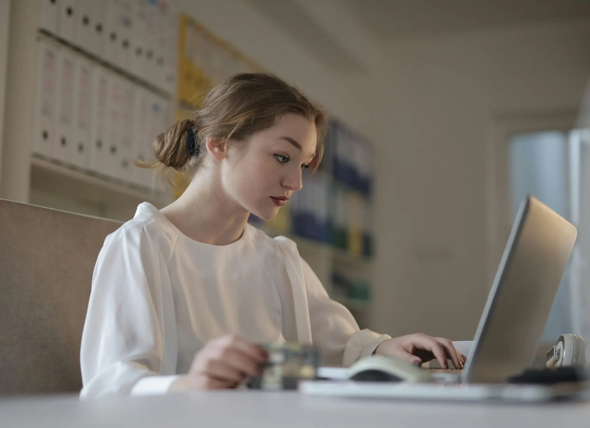 Professional working on a laptop at a cafe table