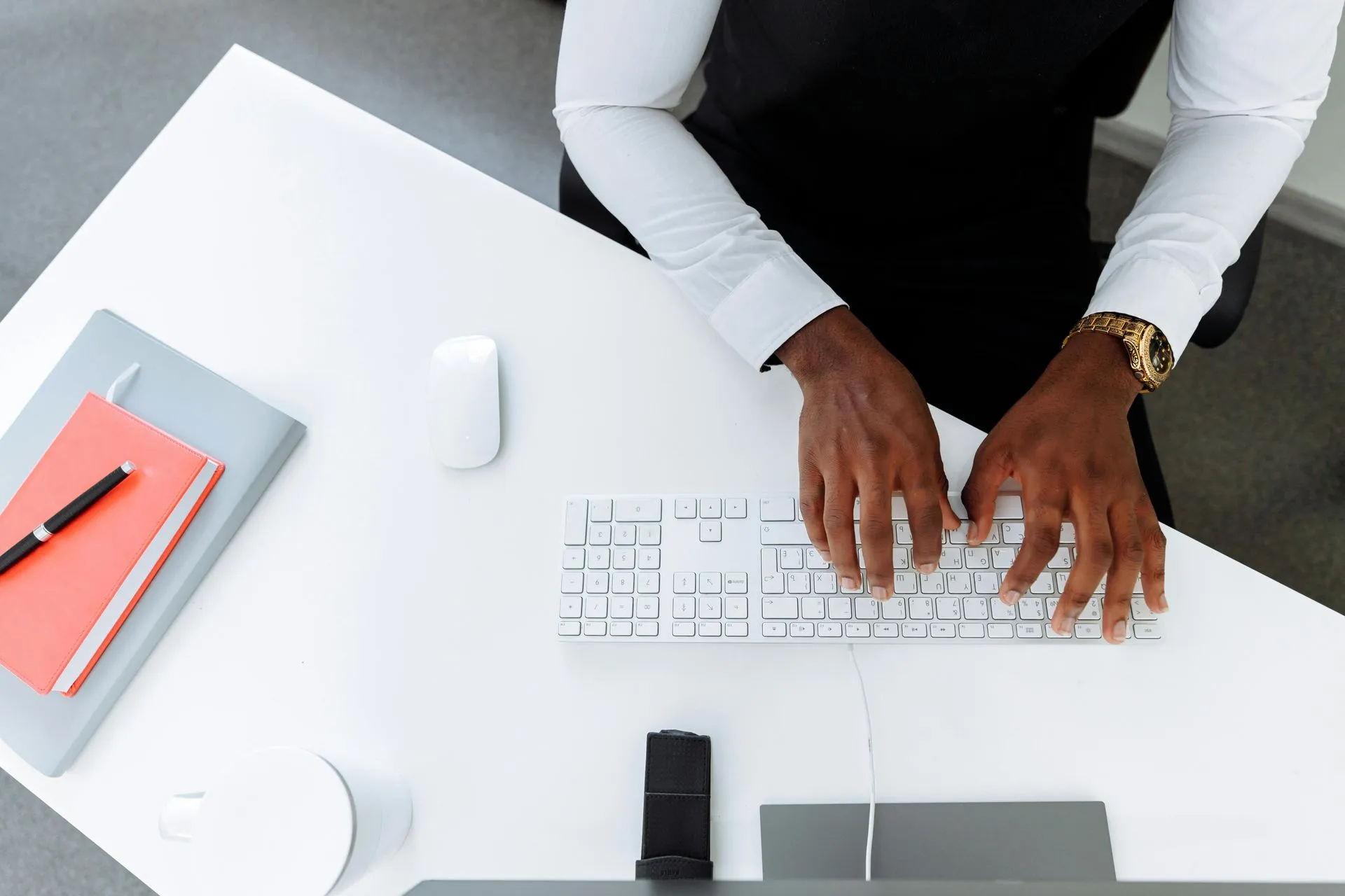 Billing professional working with records at a computer